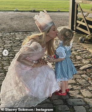 Adorable: The 23-year-old mother of five wore a pink princess dress as she transformed into Glinda 'the good witch', while Rose was dressed as Dorothy