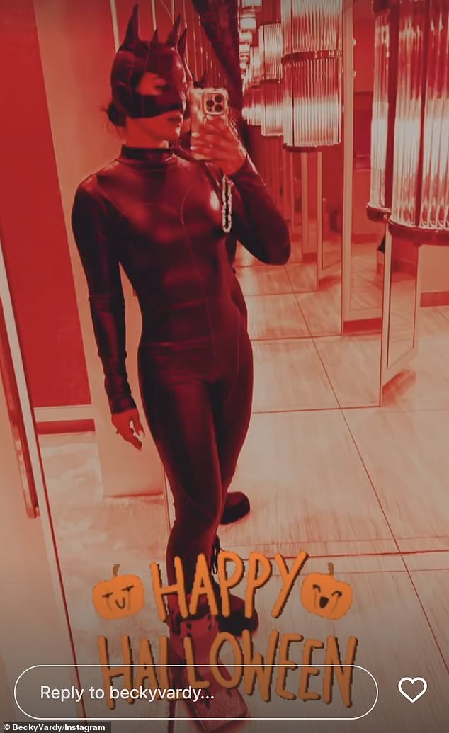 Racy: The WAG showed off her plastic air boot in the mirror selfie in her Catwoman costume after her horror accident