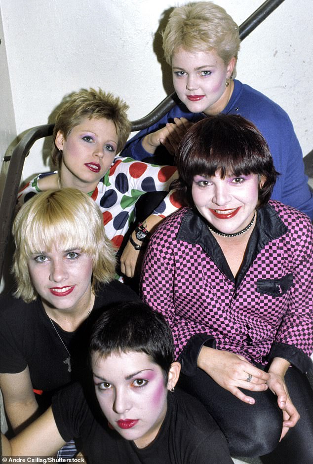 The Go-Go's, consisting of Belinda, Jane Wiedlin, Charlotte Caffey, Kathy Valentine and Gina Schock, released their debut album Beauty and the Beat in 1981.  They can be seen in 1980.