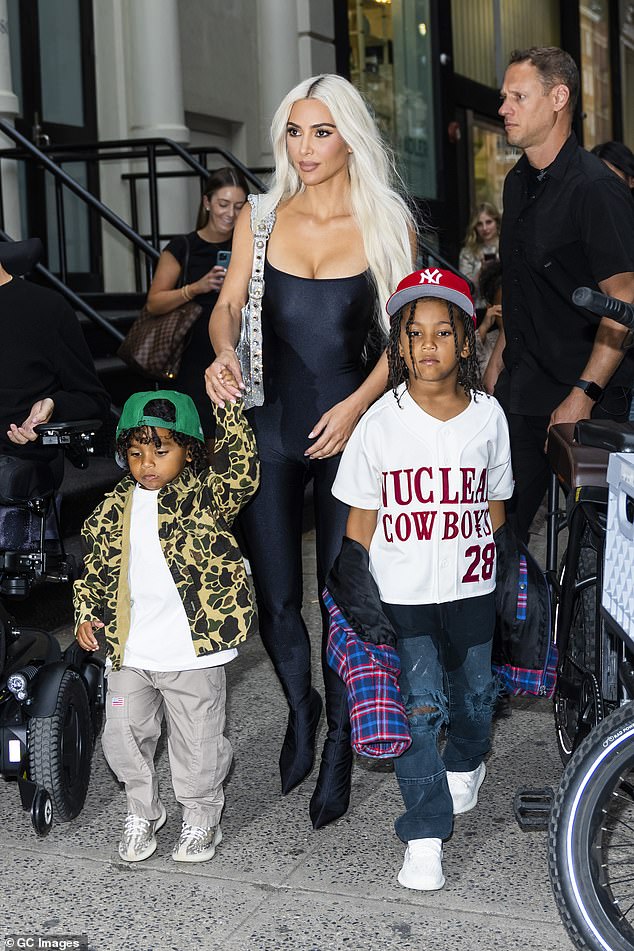 Momager: Meanwhile, Kim signed Saint's contract on his behalf due to his younger age;  seen with Saint Nicholas and youngest son Psalm, four, in 2022