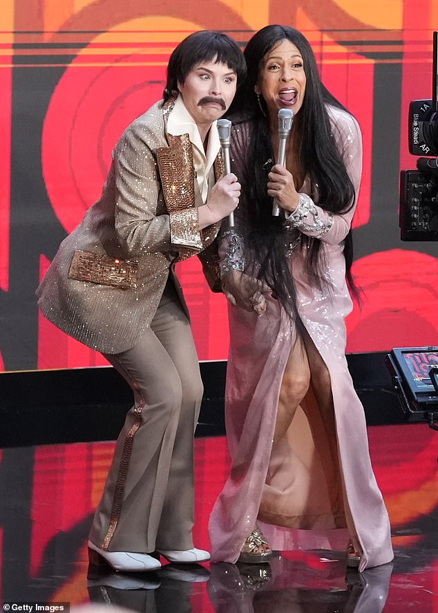 Jenna Bush Hager, 41, and Hoda Kotb, 59, went as legendary musical duo Sonny and Cher, with Hoda rocking a long, flowing pink dress, long brown wig and huge hoop earrings.