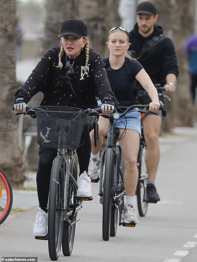 Cycling away: Even while dressed in workout clothes, she clung to a bit of glamor and sharpened her striking facial features with makeup