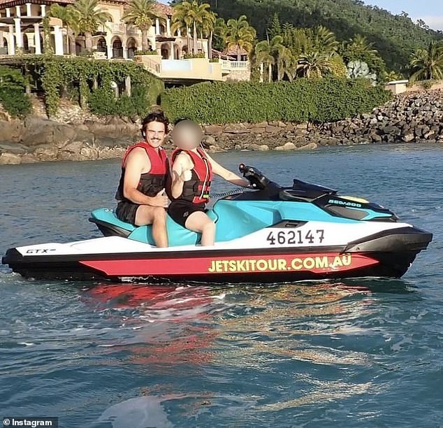 Duanne Hevers is seen on the back of a jet ski during a holiday to the Whitsunday Islands in June - before NSW Fair Trading issued a public warning about his behavior in July