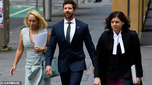 Former special forces commando Heston Russell (pictured, centre), with his lawyer Rebekah Giles (left) and lawyer Sue Chrysanthou, SC (right) before hearing they had won the case