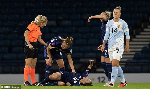 It comes just days after Scotland midfielder Caroline Weir became the latest player to suffer the injury, tearing her anterior cruciate ligament while playing for her country against Belgium on Tuesday.  Caroline Weir is pictured injured during the match at Hampden Park on September 26