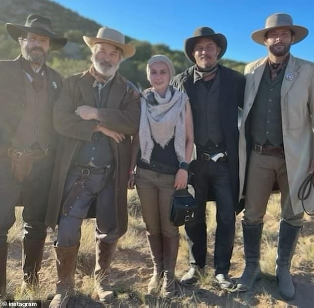 Baldwin with Hutchins (center) and other members of the film's cast on set in Santa Fe while shooting the movie Rust.  Baldwin fired a Colt .45 revolver which fatally shot Hutchins.  He is now charged with involuntary manslaughter