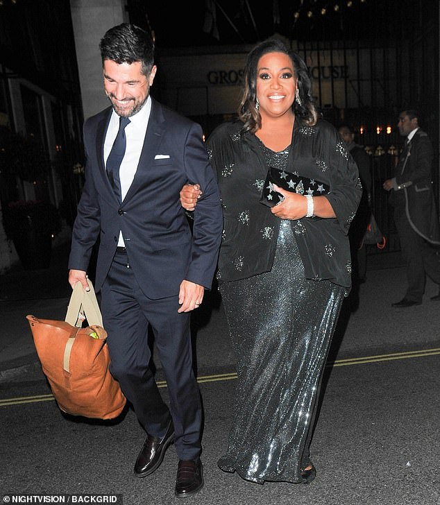 Support system: Alison Hammond left the Pride of Britain on the arm of her This Morning co-star Craig Doyle on Sunday night - amid Holly Willoughby kidnapping hell