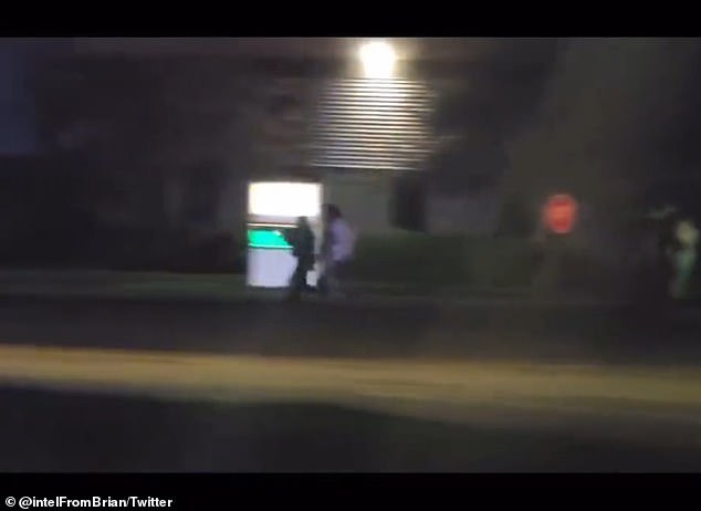 People are seen running from the scene of a mass shooting in Lewiston, Maine