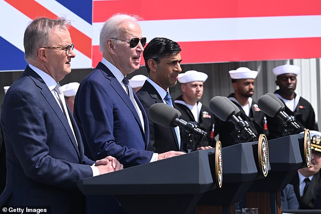 Mr Albanese (left) is pictured next to Mr Biden and British Prime Minister Rishi Sunak at the US naval base in San Diego