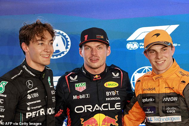 British Mercedes driver George Russell, Red Bull Racing champion Max Verstappen and Piatri pose for photos from the podium, although the Australian was robbed of his best time.