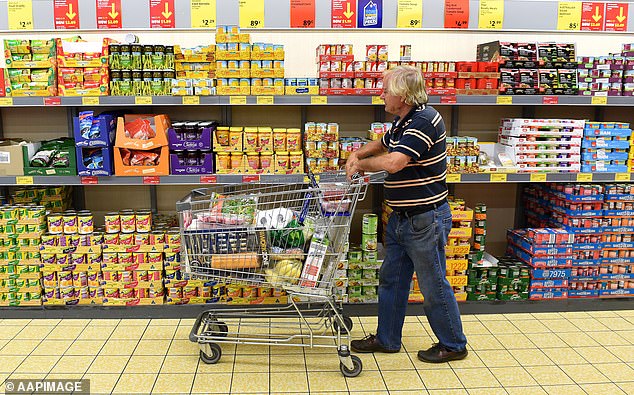 An Australian shopper has demanded supermarkets introduce a 'boomer hour' for older customers after claiming they take too much time at checkout (pictured is a shopper at an Aldi in the Gold Coast)