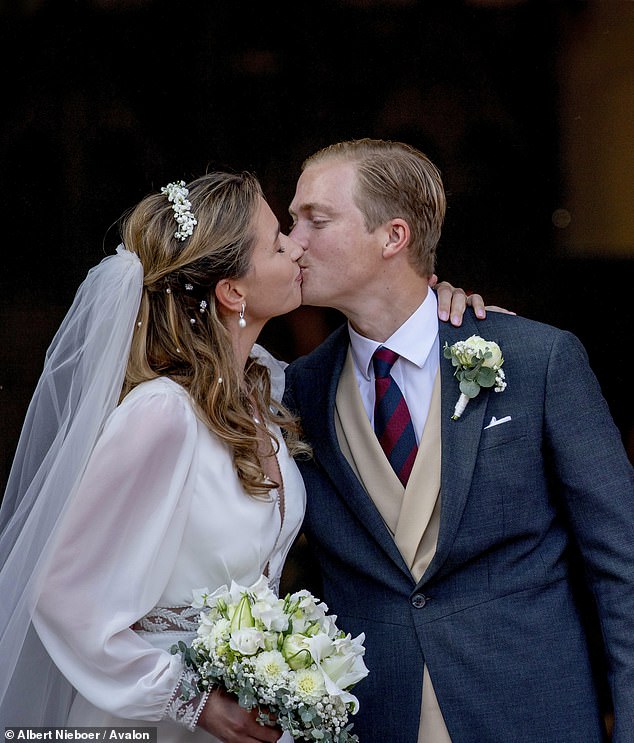 HAPPY COUPLE: Archduke Alexander of Austria and Countess Natacha Roumiantzeff-Pachkevitch kiss after their wedding ceremony at the Eglise Saint Pierre in Beloeil, Belgium