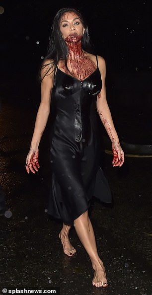 Gruesome: Nicole Scherzinger brought bloody and sexy to Halloween on Sunday