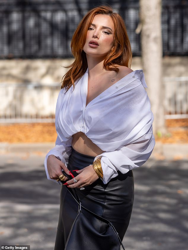 Divine: Bella showed off a glimpse of her abs in a cropped white shirt