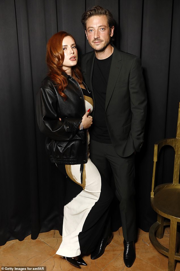 Couple Goals: Bella Thorne, 25, cozy up with Mark Emms, 44, at the amFAR Paris Fashion Week party at Sinner Paris, on Sunday