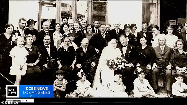 A family photo shared by Firestone shows three dozen people at a wedding before the Holocaust.  Almost all of them were killed