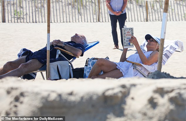 President Joe Biden (left) and first lady Jill Biden (right) return to their home in Rehoboth Beach, Delaware, this weekend.  They are photographed reading and napping on the beach during a trip to the seaside in August