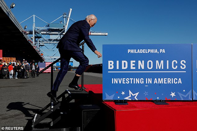 President Joe Biden climbs the steps to deliver remarks on his economic goals at the Tioga Marine Terminal in Philadelphia, Pennsylvania, U.S., October 13, 2023. He stumbled briefly before regaining his balance and resuming his activity.