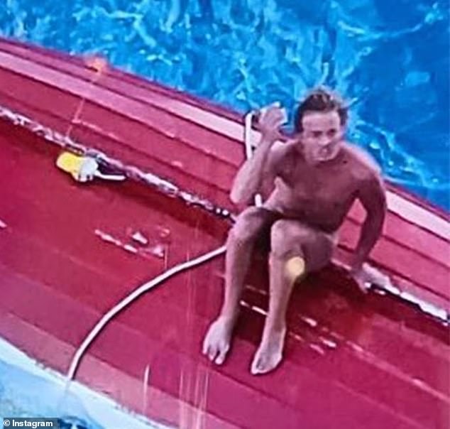 Tom Robinson, a 24-year-old Brisbane man, was rescued by a P&O cruise ship south of Vanuatu on Friday morning (pictured, Mr Robinson on top of his boat)