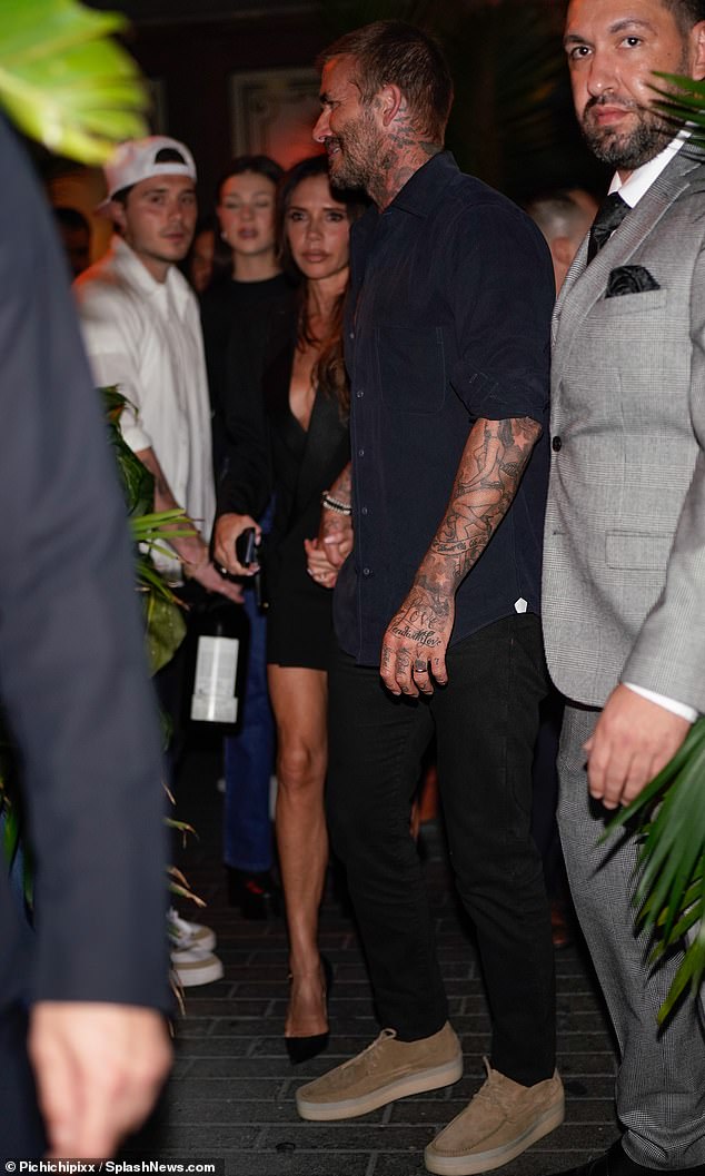 Socializing: David and Victoria Beckham put on a united front in their first public appearance since Rebecca Loos spoke out about her alleged affair with the footballer