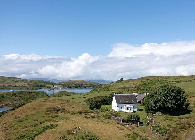 The stone farmhouse on Torsa Island, Inner Hebrides, Scotland, is surrounded by land mainly used for grazing sheep and cattle