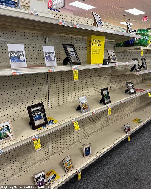 Framed images of goods including toilet paper and kitchen towels have replaced the actual items on the shelves of a Washington DC pharmacy