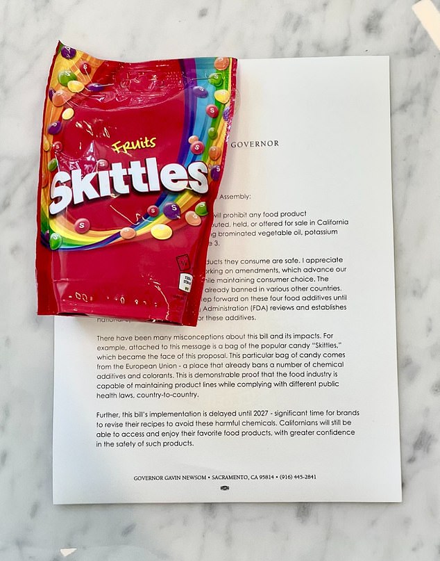 Newsom sent a letter confirming he had signed the bill.  He attached a bag of European Union Skittles and said it was proof that companies could change their recipes