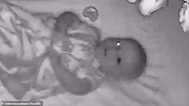 Benny was diagnosed with a rare form of eye cancer at six months old after this image appeared on his baby monitor.  One of his eyes had turned black