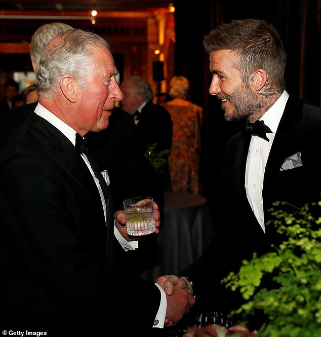 Prince Charles greets David Beckham at the 2019 premiere of the Netflix documentary Our Planet at the Natural History Museum