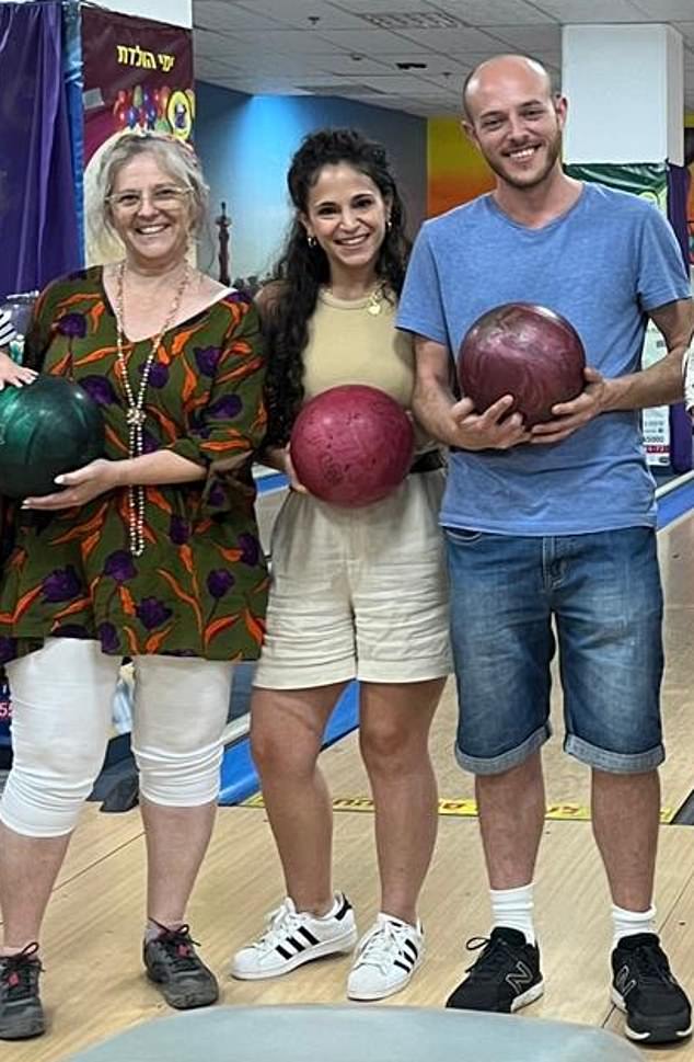 Miryam Shafir (55) with her son, Dor Shafir, and his fiancé, Savion Hen Kiper (center, confirmed dead), at a bowling alley