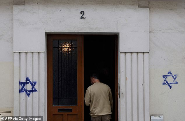 Dozens of blue Stars of David (pictured) have been found painted on buildings in various parts of Paris and the surrounding suburbs at night