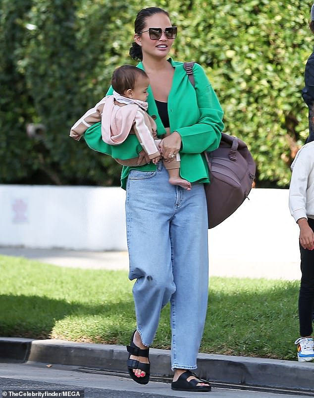 Doting mom: Chrissy Teigen was pictured spending time with her kids in Los Angeles on Sunday afternoon