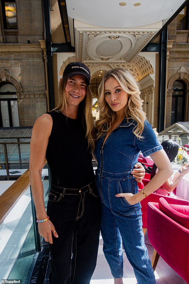 Christian Wilkins (pictured left) looked fit as he attended the opening of the new Acero Gym in Sydney's CBD on Monday.  The Dancing with the Stars alum, 28, posed for several photos with some famous friends, including Simone Holtznagel (pictured right)