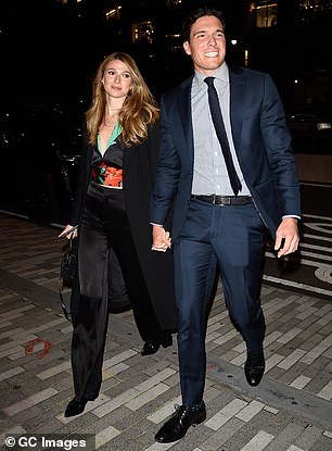 Event ready: He added a striped shirt as well as a dark navy tie to complete his overall look and also slipped on black shoes