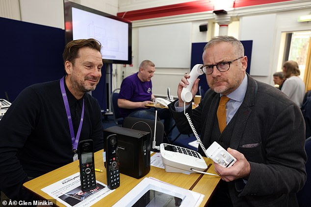 Expert tip: Reporter Toby Waln (right) tests the digital phone with BT's Lee Barlow