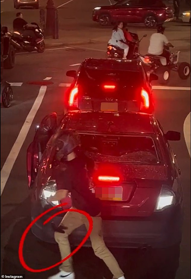 The footage, filmed Sunday night, comes from Philly and reportedly shows 26-year-old Cody Heron embarking on the rampage, hitting Nikki Bullock's car and eventually climbing and destroying the rear window before fleeing