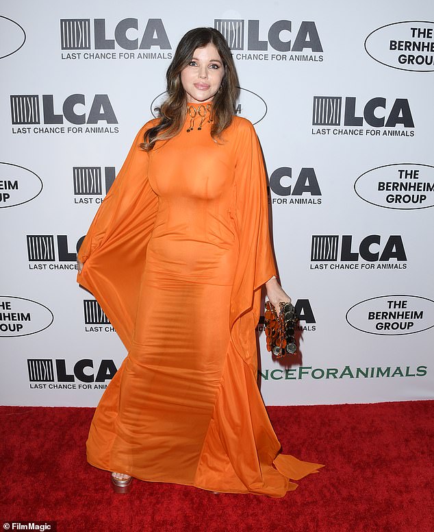 Pure genius: Donna D'Errico shines at the rousing Last Chance For Animals event in Beverly Hills.  The Baywatch veteran wore a very sheer bright orange long dress with pirate sleeves