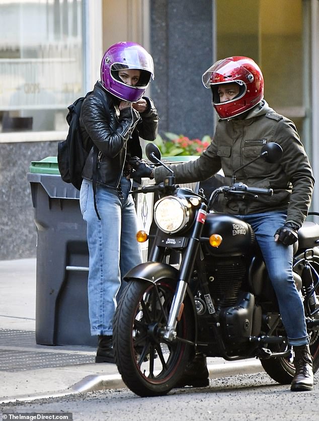 Exclusive photos from DailyMail.com show Amy Robach and TJ Holmes taking his new Royal Enfield motorcycle for a spin in Manhattan on Tuesday