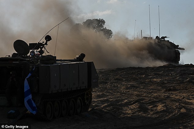 The tank moves through the area near Kibbutz Be'eeri near the Gaza Strip on October 13, 2023 in Be'eeri, Israel.  Israel has blockaded Gaza and launched airstrikes on Palestinian territory after a Hamas attack that killed hundreds and took more than 100 hostages