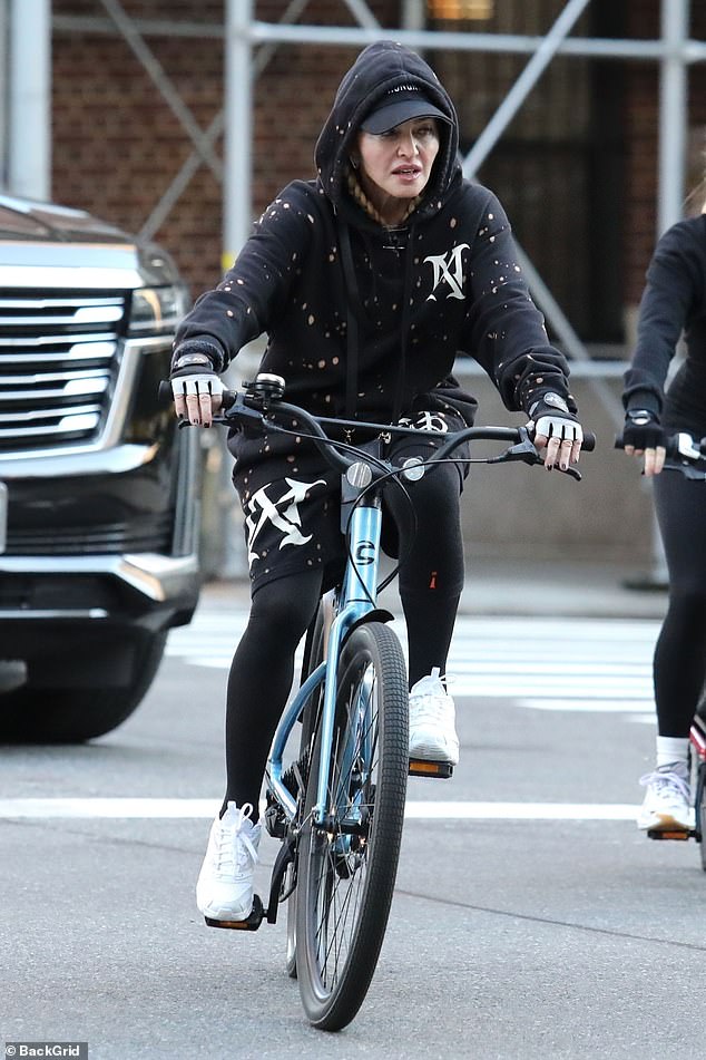 Sighting: Madonna, 65, looked radiant as she enjoyed a bike ride in New York City on Wednesday - days before her rescheduled Celebration Tour kicked off