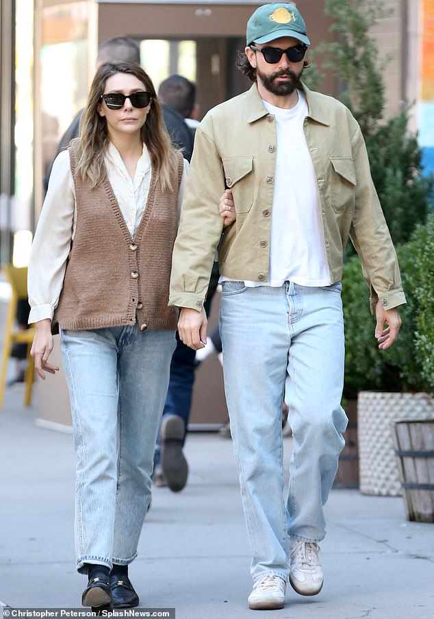 Couple Goals: Elizabeth Olsen and her husband Robbie Arnett looked in love as they walked arm in arm on their way home from breakfast in New York on Tuesday