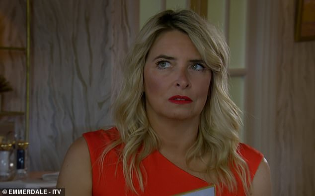 Tense: It was another busy episode of Emmerdale on Wednesday night as Charity Dingle (Emma Atkins) gushed about her ex Mackenzie and Chloe's engagement