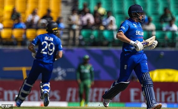 England's Jonathan Bairstow and Dawid Malan score during the ICC Men's Cricket World Cup match between England and Bangladesh in Dharamshala, India, Tuesday, October 10, 2023. (AP Photo/Ashwini Bhatia)