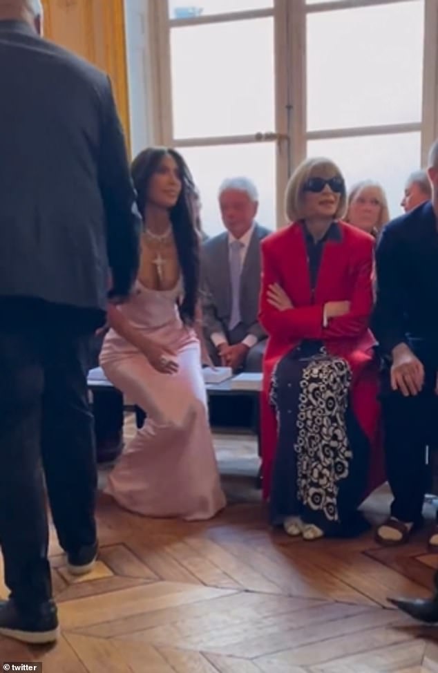 'Anna's body language': In one video, the reality star, 42, arrived and sat next to Vogue's editor-in-chief, 73, who looked like she was deliberately moving chairs to avoid Kim