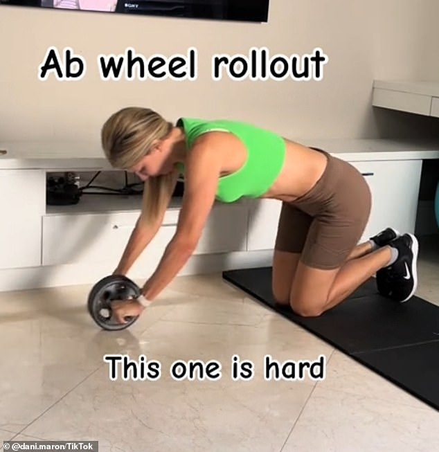 Showing no signs of slowing down, Dani then launched an 'ab wheel rollout', which she admitted was 'difficult'