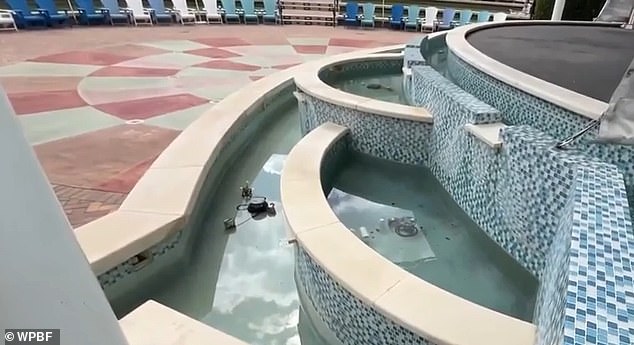 The fountain is separated from the splash pad by a small wall and is located in an open-air amphitheater used for music concerts