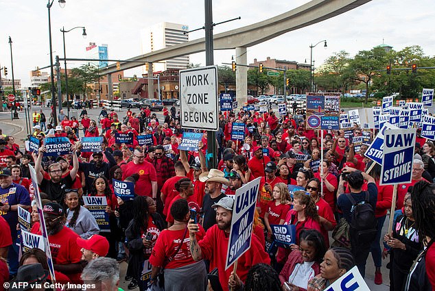 UAW workers march through the streets of downtown Detroit after a rally on the first day of the UAW strike in Detroit, Michigan, on September 15, 2023