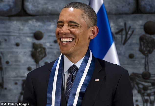 US President Barack Obama laughs during an official state dinner at the presidential residence in Jerusalem in 2013 -