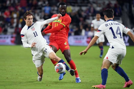 American forward Brenden Aaronson (11) is pushed off the ball by Ghanaian midfielder Elisha Owusu (11) during the second half of Tuesday's friendly match.