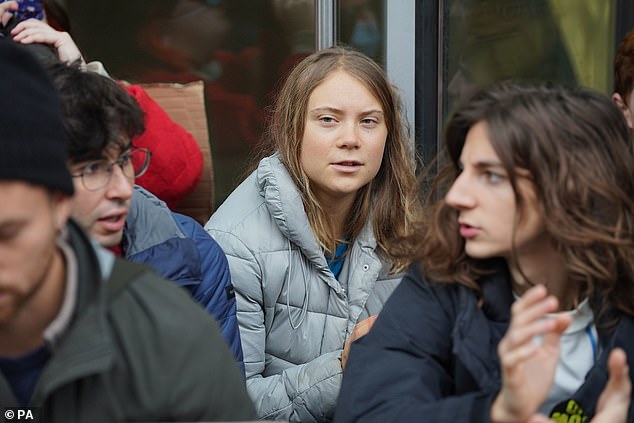 Climate activist Greta Thunberg joins Fossil Free London protesters in a demonstration outside JPMorgan's Canary Wharf offices